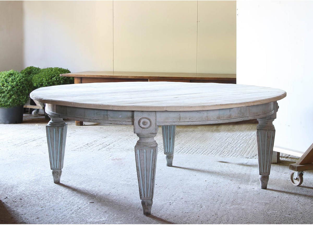 Large Italian round table with reeded leg and light blue wash finish and scrubbed top