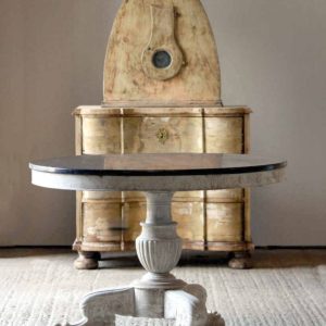 Gueridon table with black marble top and grey veining