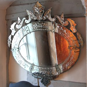 An oval Venetian Mirror with original mercury glass and elegant panelling for all areas.
