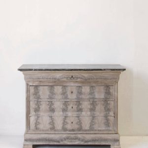 A bleached Louis Philippe commode with a marble top and five drawers