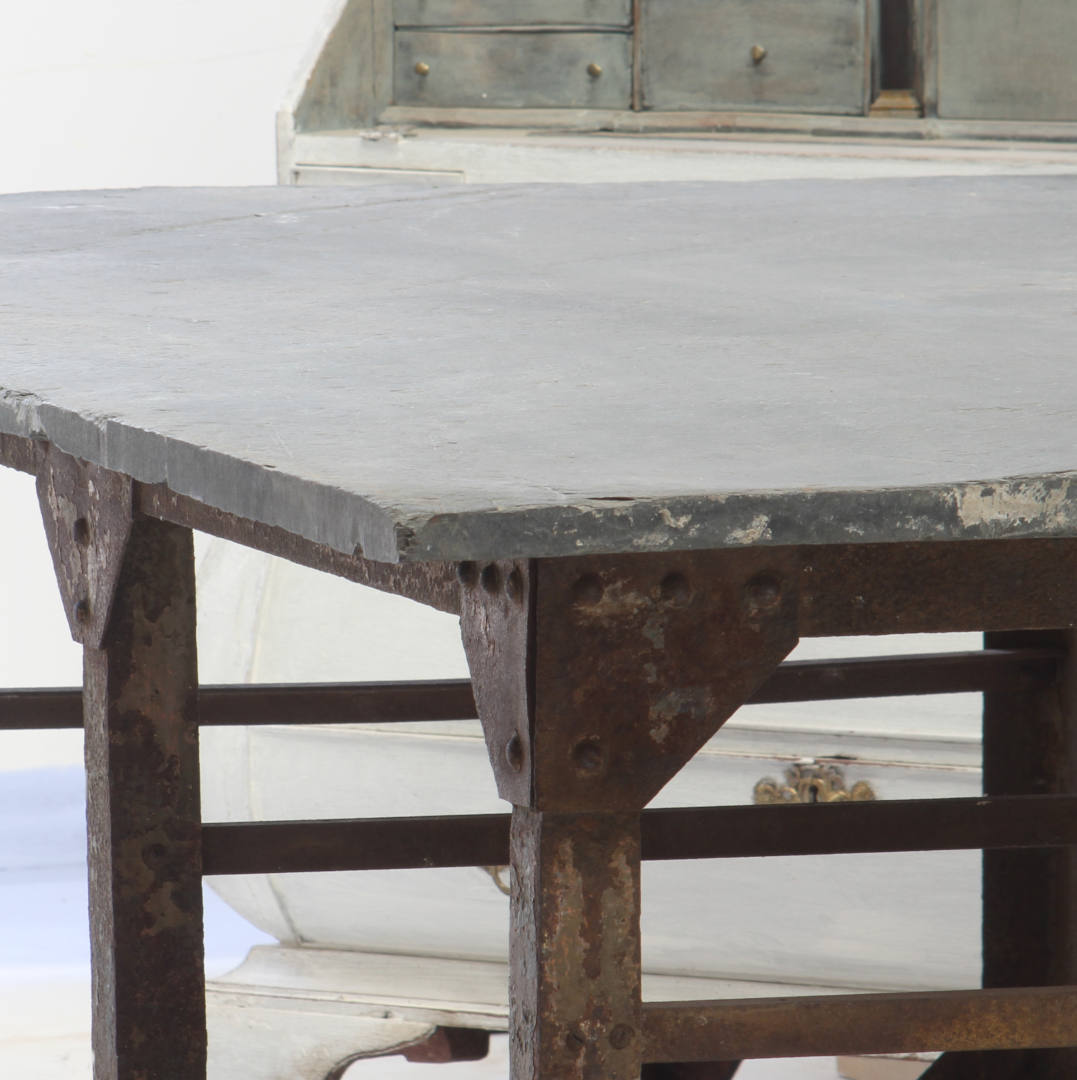 A corner view of the slate top table showing more detail of the rivets