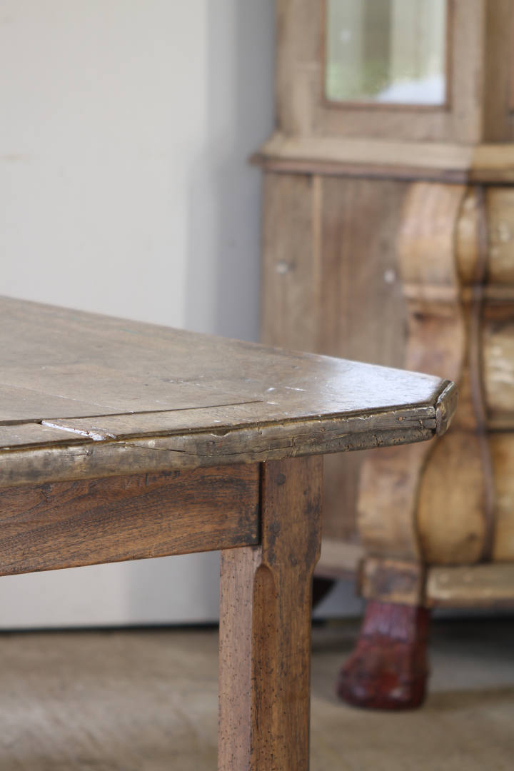 An early French farmhouse with a two plank walnut top and rich patina