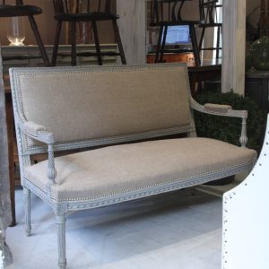 French sofa with classic Louis XVI carving and turning