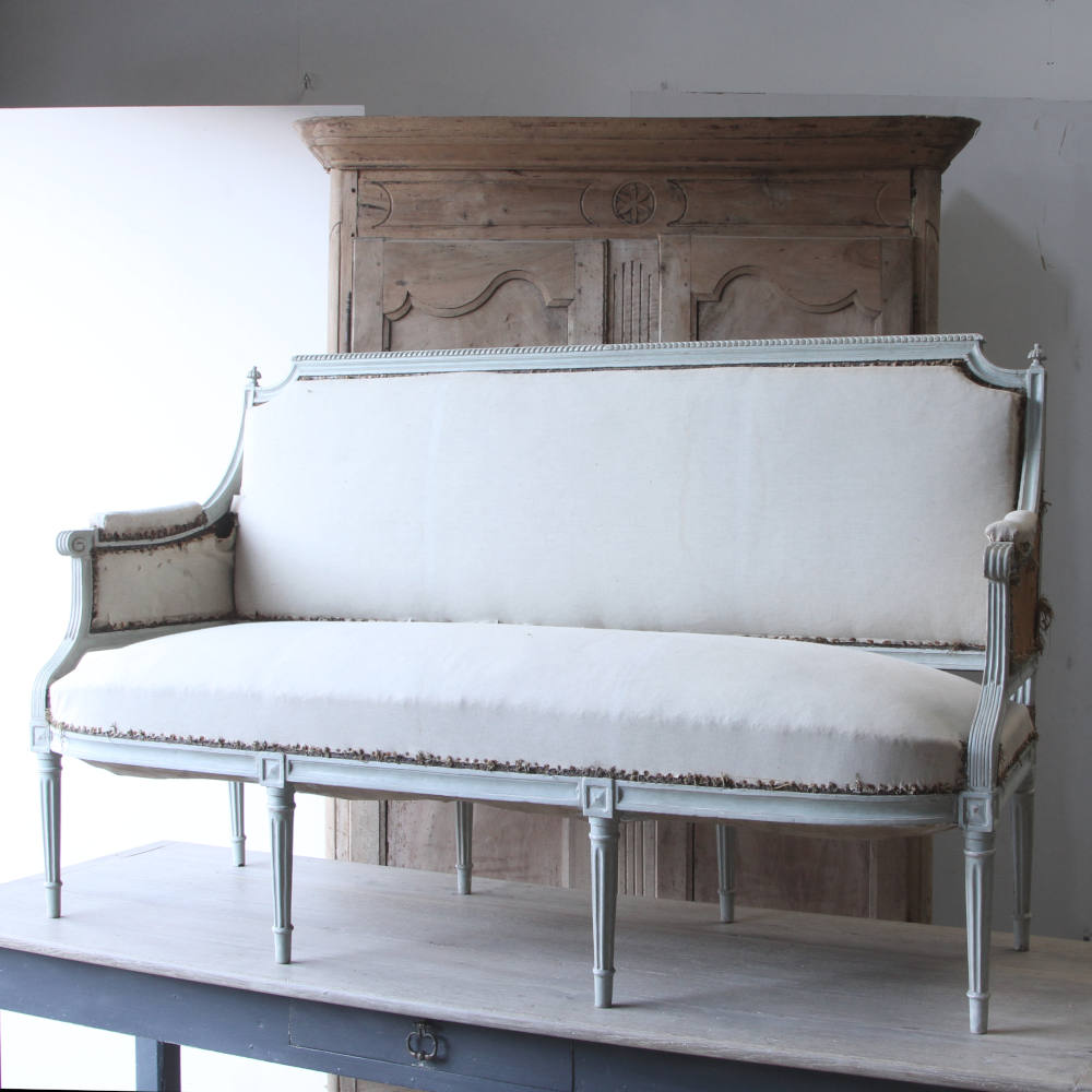 A French sofa from the 19th century with reeded carving