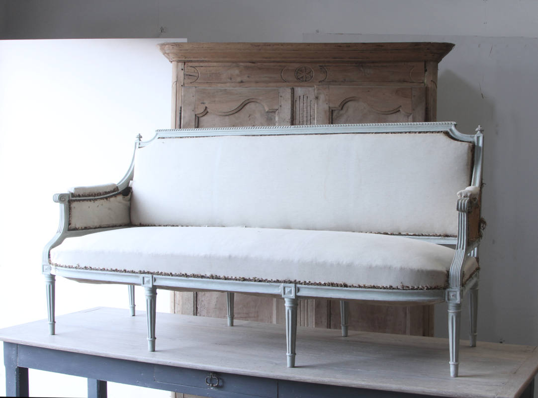 An elegant 19th century French sofa deconstructed for reupholstery