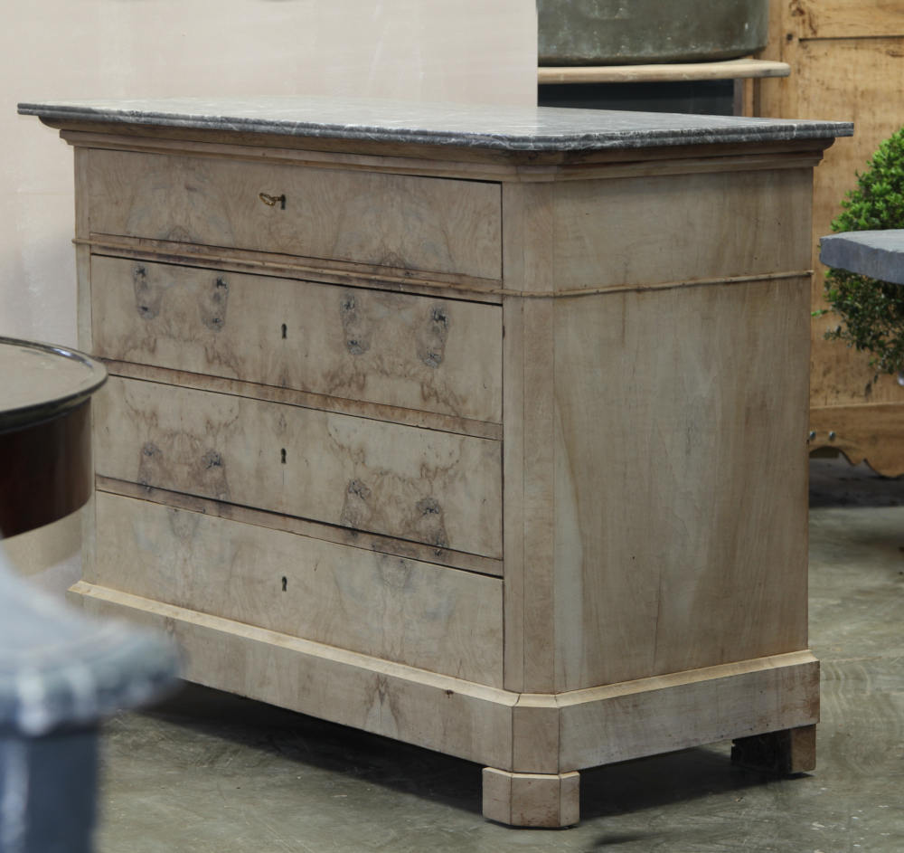 A Louis Philippe commode in a bleached finish right side view