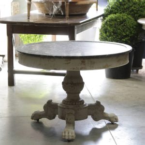 A marble topped gueridon table with a distressed painted finish